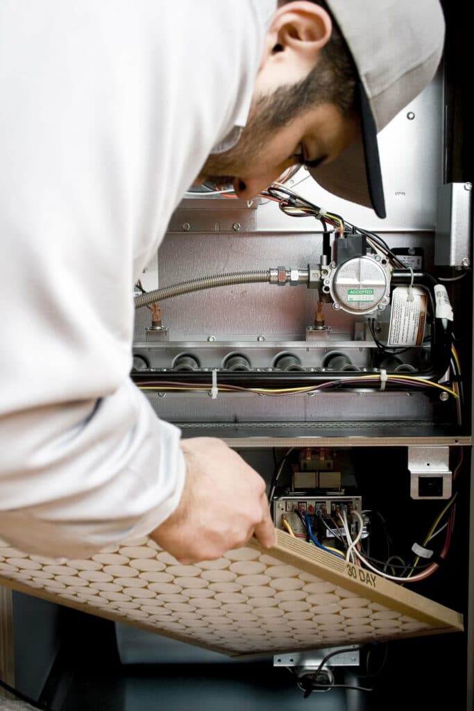 replacing AC filter in HVAC system in Shreveport, LA