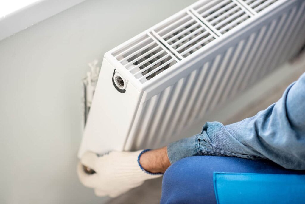 heating technician installing new heating system